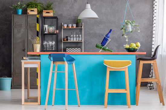 Sky Blue Takes Centre Stage

Sky blue and distressed grey do wonders for this minimalist home, where just the bare minimum seems to work perfectly well! Mismatched, recycled stools sit around the breakfast counter, hand-painted in an eye-catching shade of blue.